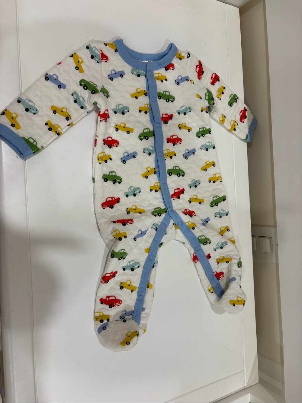White Footed Baby One-Piece with Multicolor Car Print and Light Blue Trim